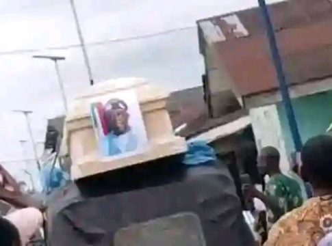 Protesters Display Symbolic Funeral With Empty Coffin For President Tinubu